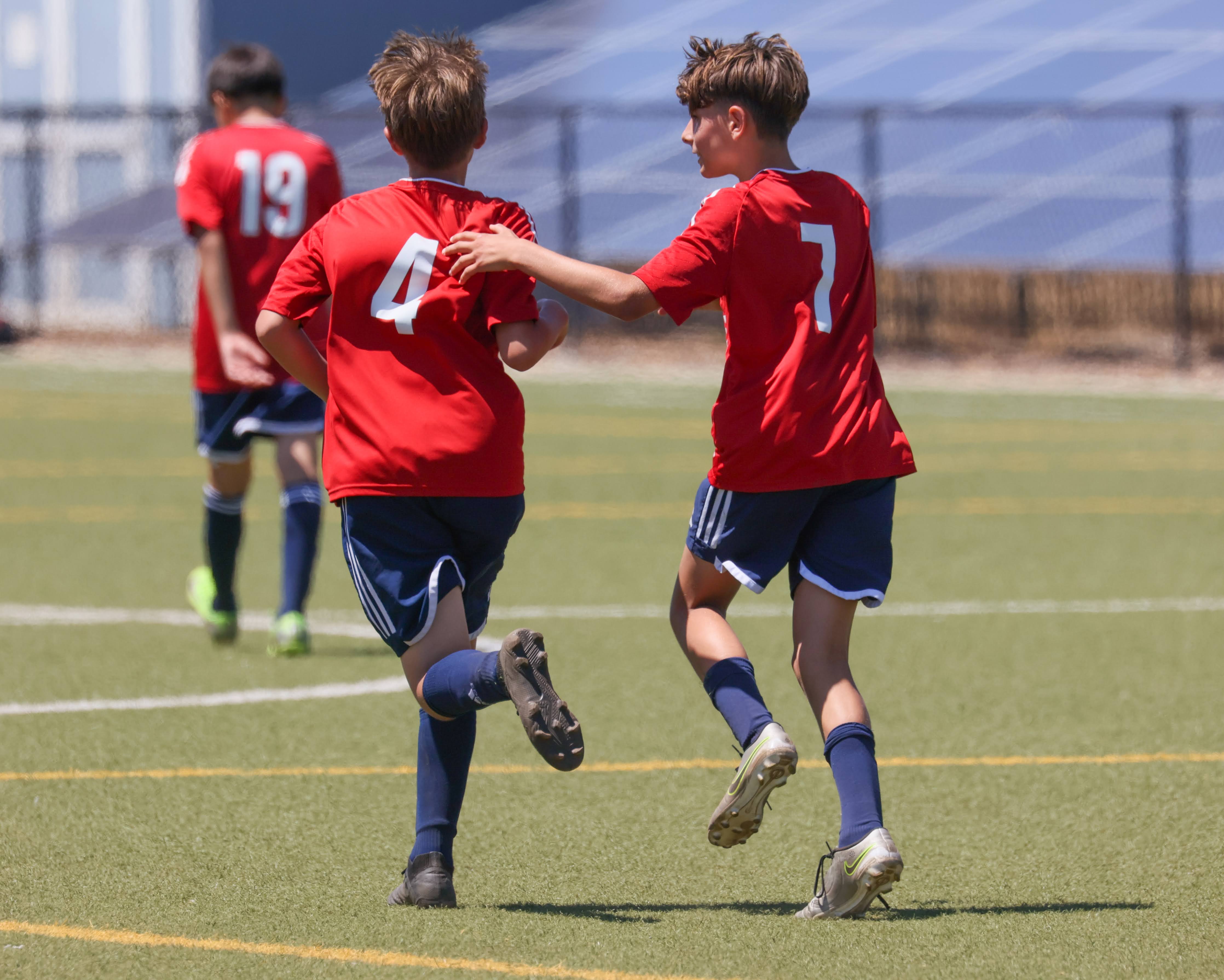 Two SPARTANS teammates supporting one another during a match
